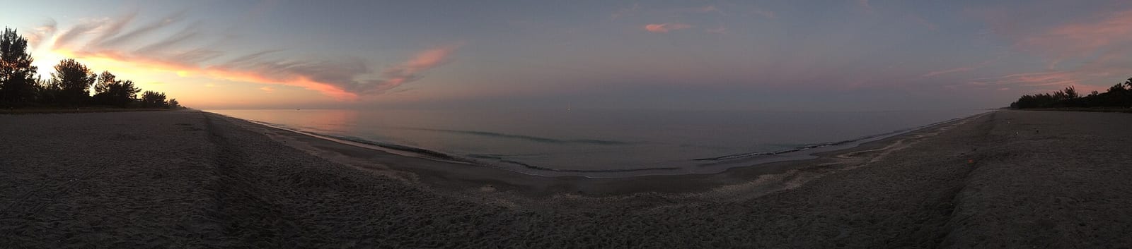Allison Hagerup Beach: beach at dusk with calm water and distant treeline under pink sky