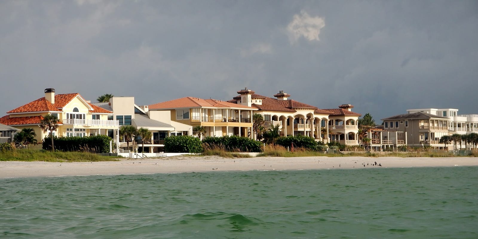 Belleair Beach: beachfront residential homes with sand and ocean water