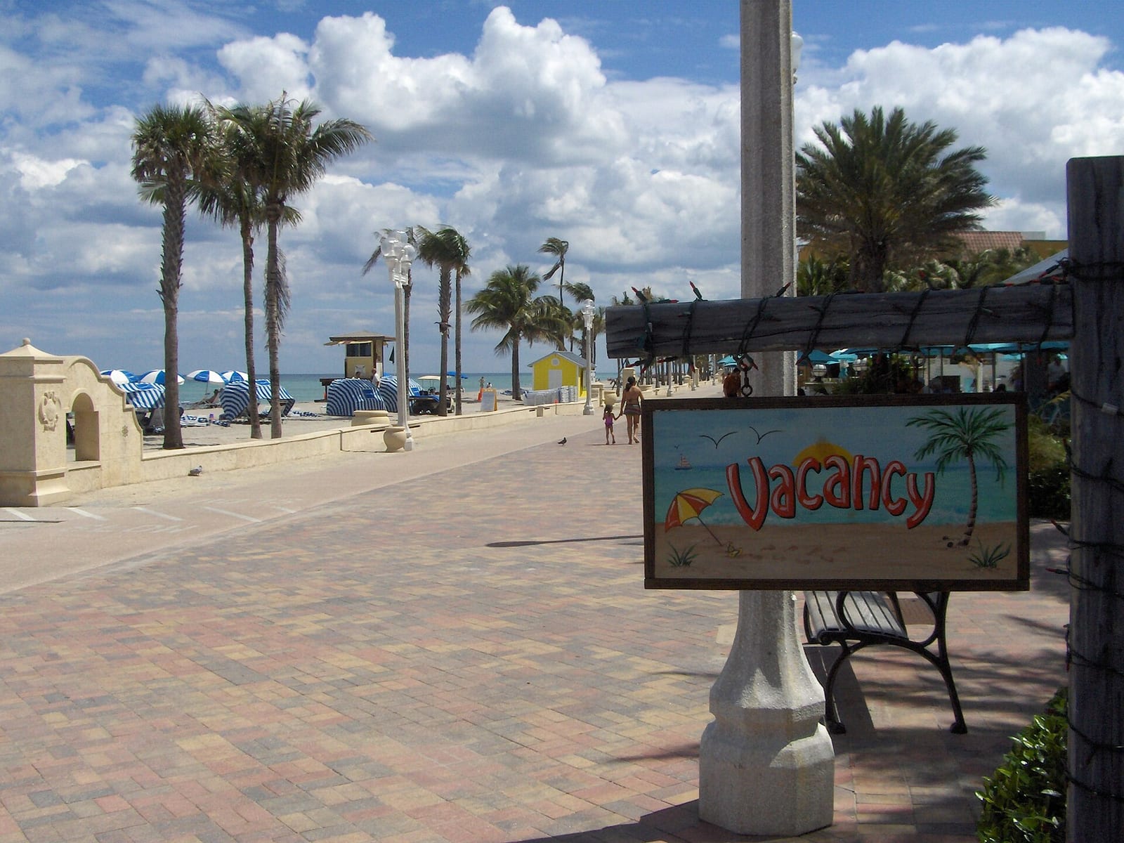 Hollywood Beach: beach boardwalk with palm trees, vacancy sign, and ocean view