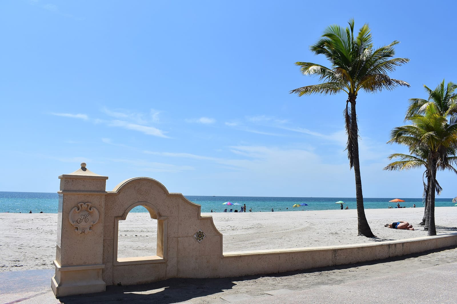 Hollywood Beach: decorative arch gateway on beach promenade with palm trees