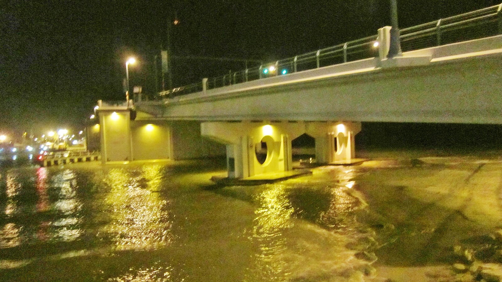 Hubbard's Beach: bridge over water at night with illuminated support structures
