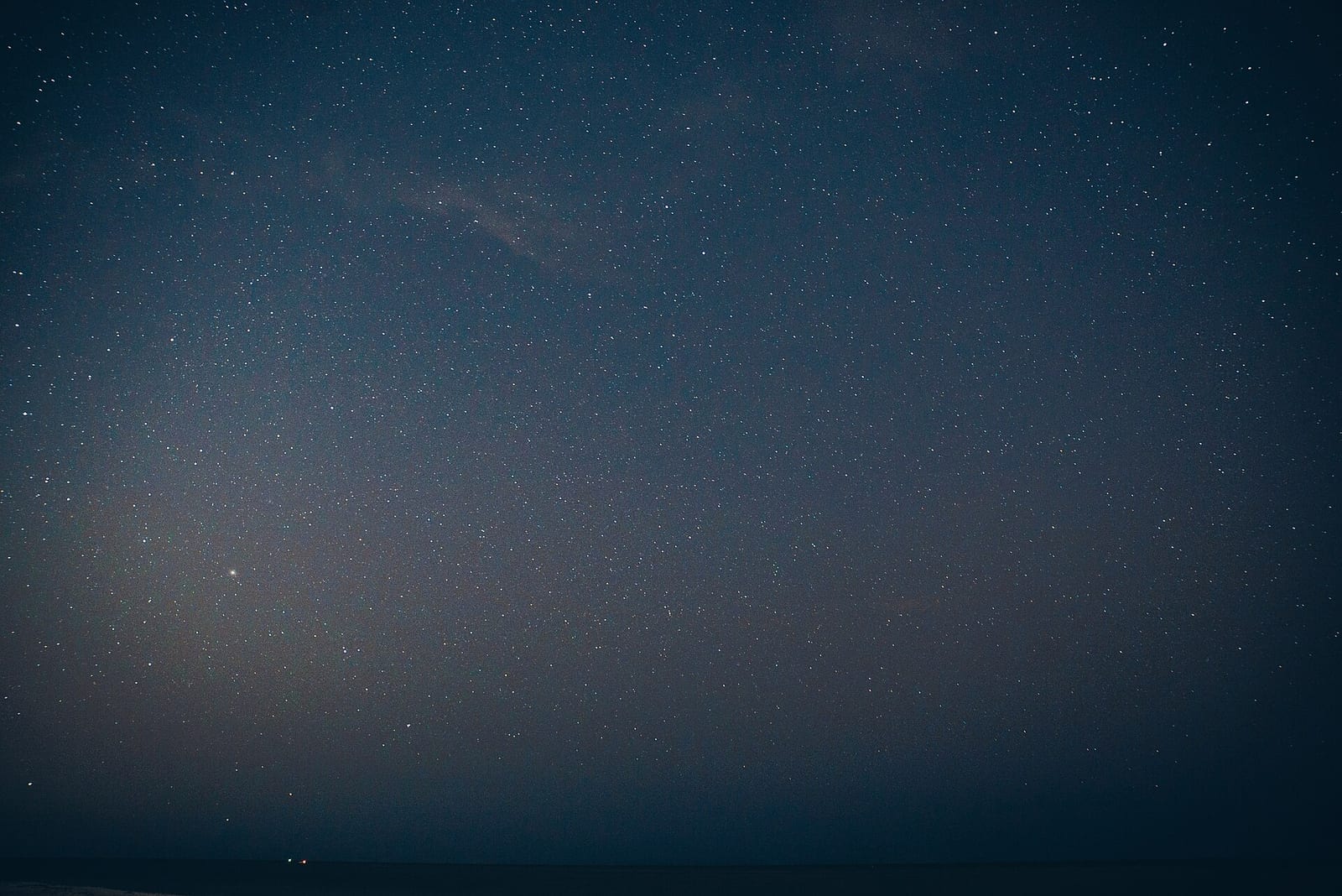 Lee County Dog Beach: night sky with stars over dark ocean water and shoreline