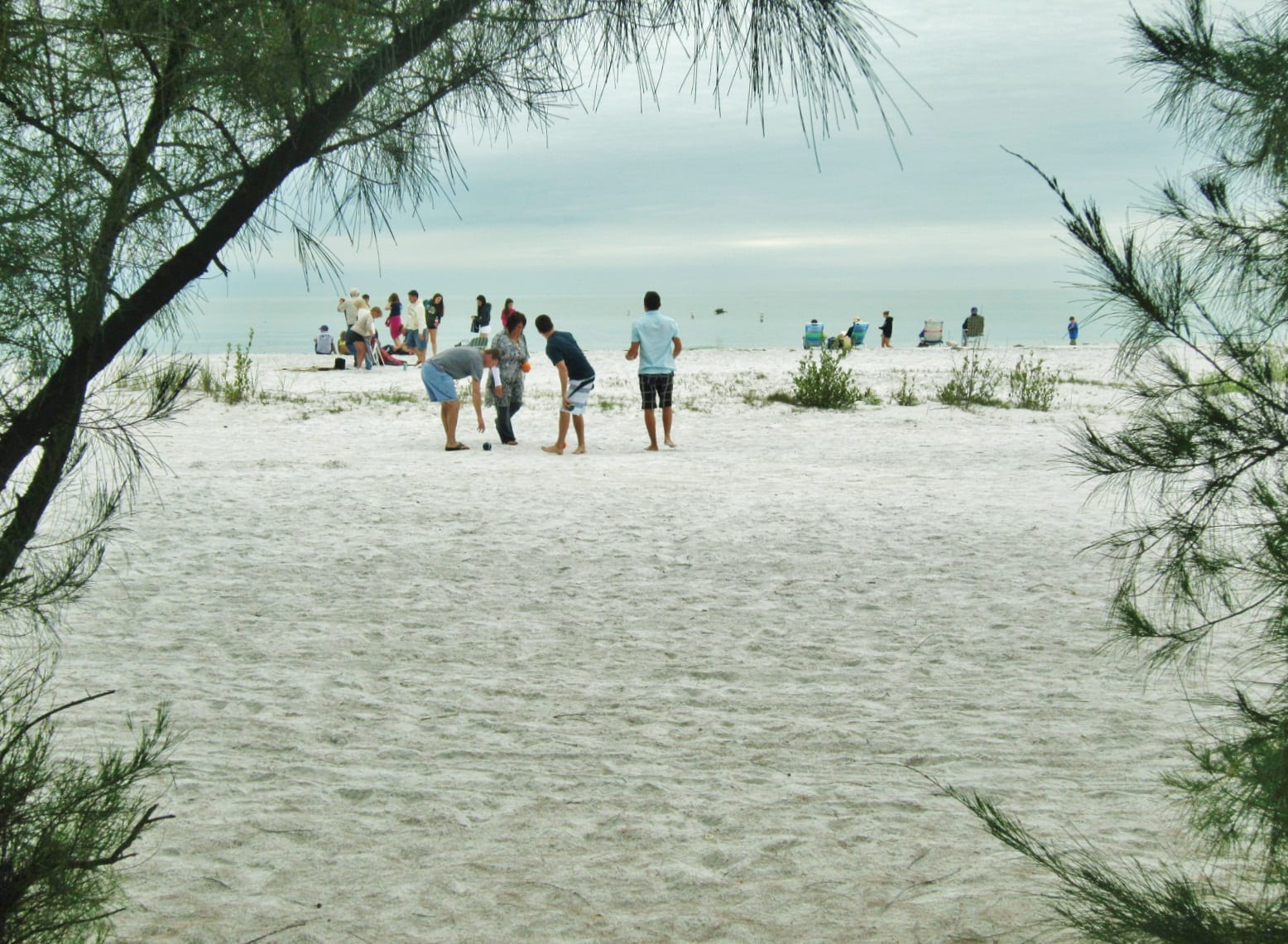 North Beach: beach scene with multiple people walking and gathering on sand