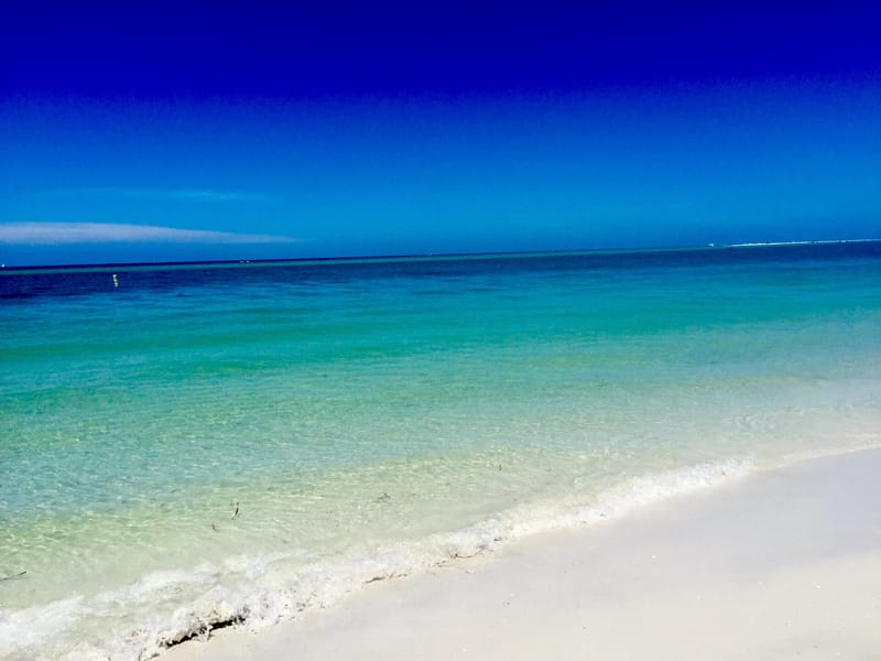 North Beach: white sand beach with turquoise water and clear blue sky