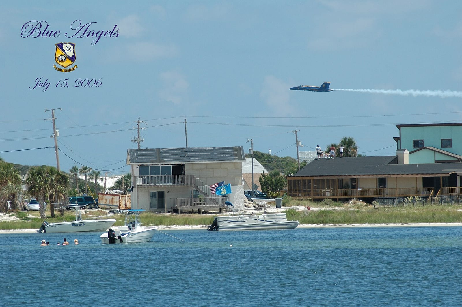 Park West On-Leash Dog Beach: beachfront houses, boats, swimmers in water, military jet overhead