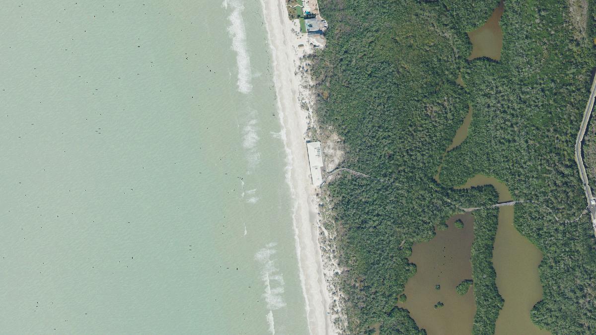 Aerial view of Pelican Bay North Beach in Naples, Florida, shoreline and surroundings, USDA NAIP imagery from May 2023