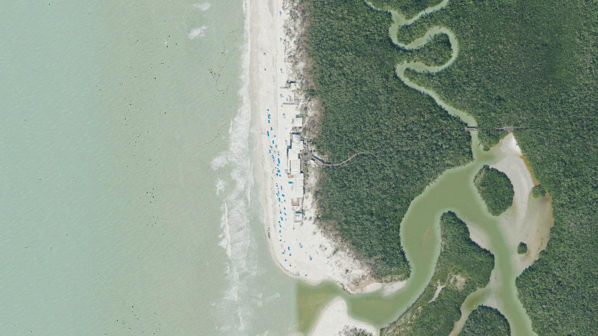 Aerial view of Pelican Bay South Beach in Naples, Florida, shoreline and surroundings, USDA NAIP imagery from May 2023