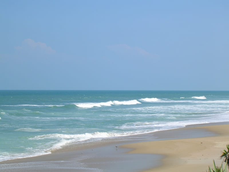 Playalinda Beach (Nudist Area): sandy beach with ocean waves and clear blue sky