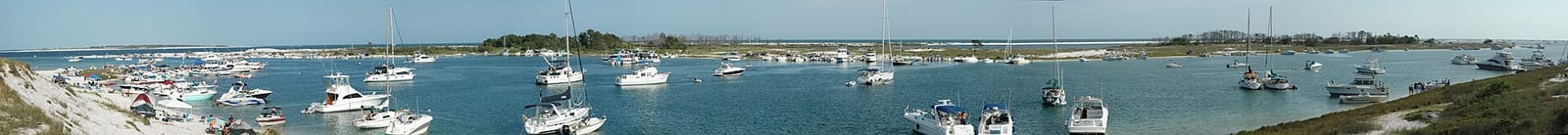 Robertson Island: harbor with numerous moored sailboats and fishing vessels