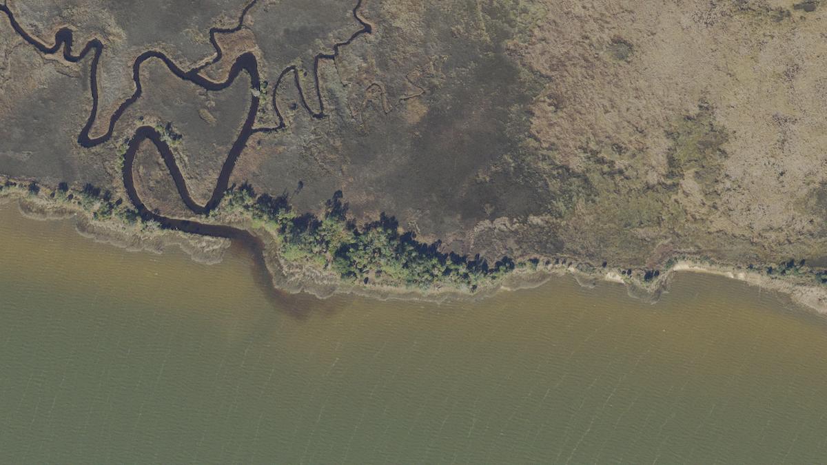 Aerial view of Sand Beach in St. George Island, Florida, shoreline and surroundings, USDA NAIP imagery from May 2023