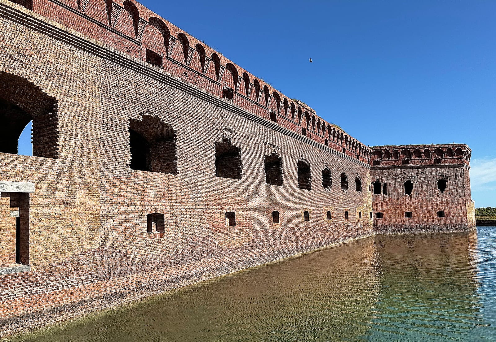 South Swim Beach: historic brick fortification with water moat and clear sky